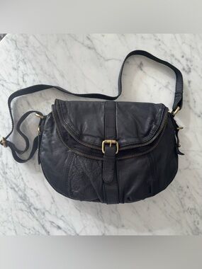 Genuine black leather with brass accents crossbody